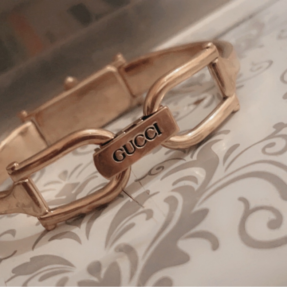 Women’s gold Gucci watch